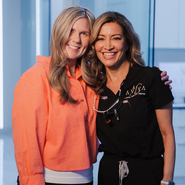 AVIVA-Dental-Implant-Center-dentist-with-a-happy-patient-both-smiling